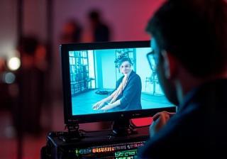 Director watching playback on set monitor